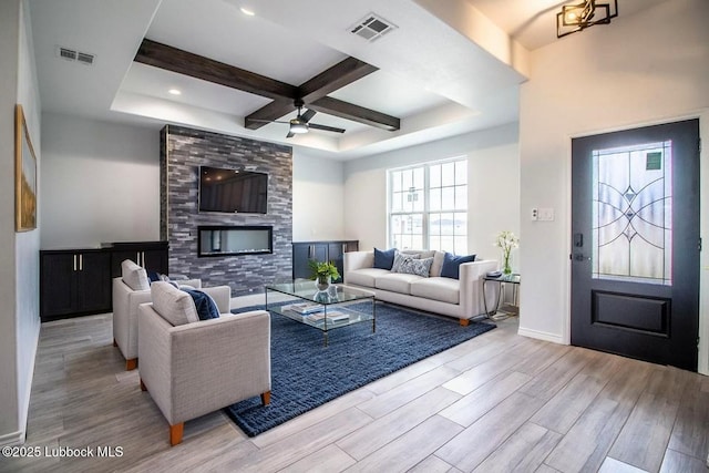 1607 Quincy Ave, Lubbock, TX 79416 - living room featuring a ceiling fan, wood finished floors, beam ceiling, coffered ceiling, and baseboards