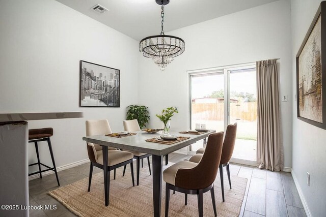 1607 Quincy Ave, Lubbock, TX 79416 - dining room with a chandelier and baseboards