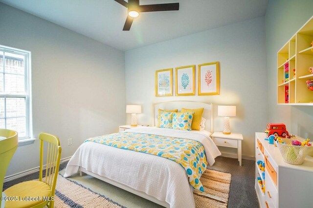 1607 Quincy Ave, Lubbock, TX 79416 - bedroom with baseboards, carpet floors, and ceiling fan