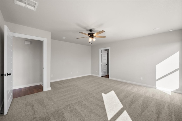 spare room with carpet floors and ceiling fan