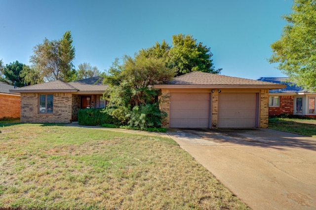 ranch-style house with a front yard and a garage