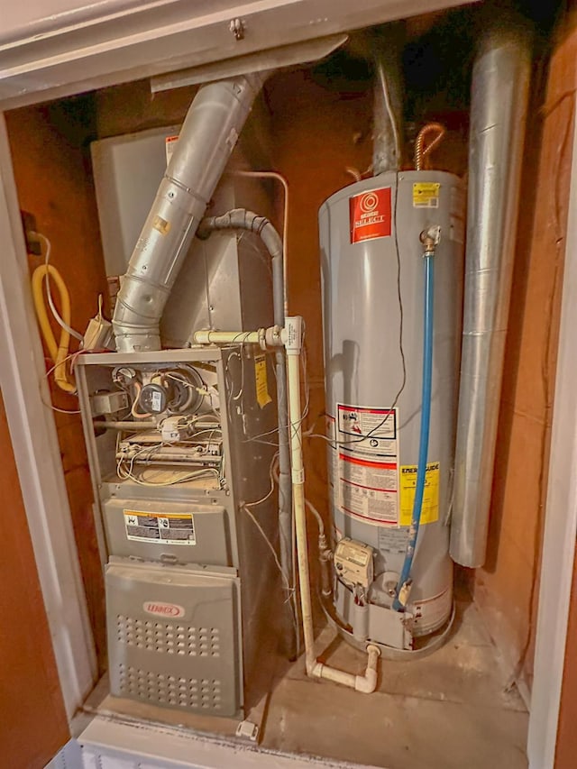 utility room featuring gas water heater