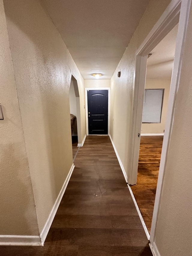 hall with dark hardwood / wood-style floors