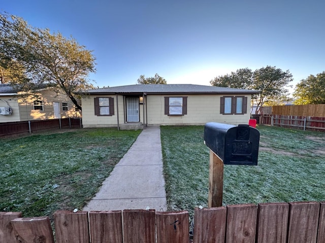 single story home with a front yard