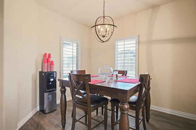 721 N 7th St, Wolfforth, TX 79382 - dining room with baseboards and a notable chandelier