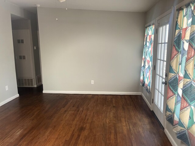 2602 45th St, Lubbock, TX 79413 - empty room with baseboards, wood finished floors, and french doors