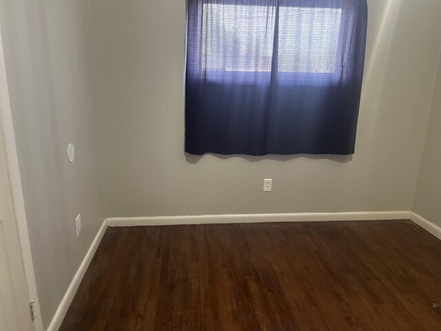2602 45th St, Lubbock, TX 79413 - empty room with baseboards and wood finished floors