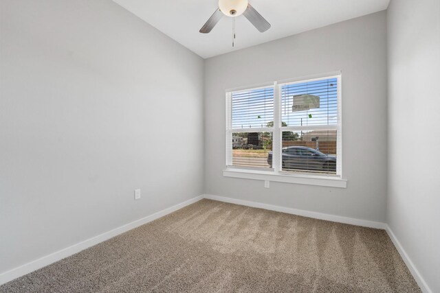 carpeted empty room with ceiling fan