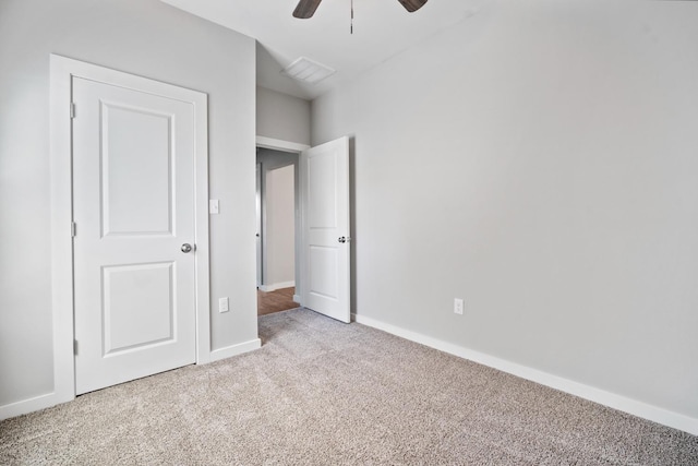 unfurnished bedroom with light carpet and ceiling fan