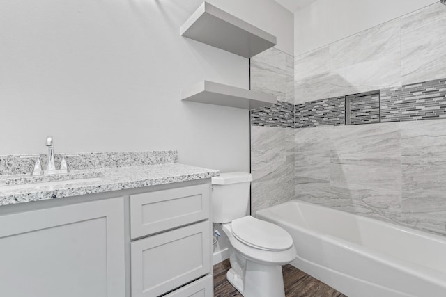 bathroom with hardwood / wood-style flooring, vanity, and toilet