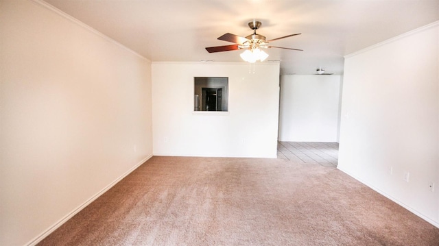 unfurnished room with ornamental molding, carpet floors, and ceiling fan