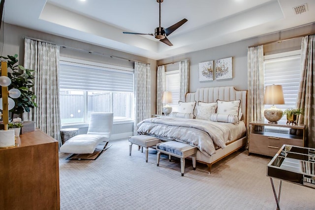 4821 119th Pl, Lubbock, TX 79424 - carpeted bedroom with a raised ceiling and a ceiling fan