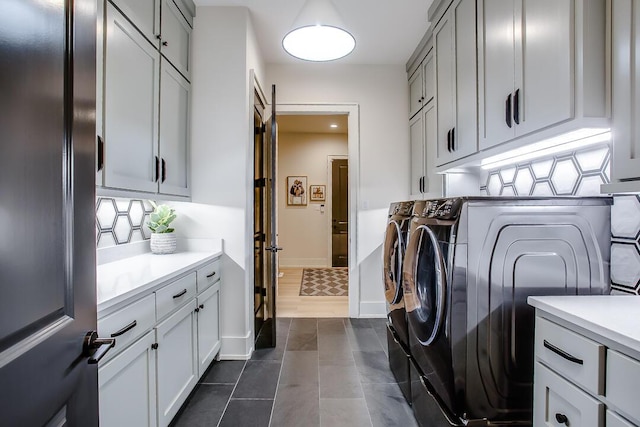 4821 119th Pl, Lubbock, TX 79424 - washroom featuring cabinet space, separate washer and dryer, and baseboards
