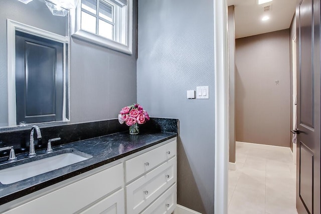4821 119th Pl, Lubbock, TX 79424 - bathroom featuring vanity, tile patterned floors, and baseboards