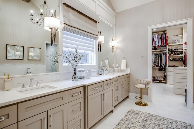 4821 119th Pl, Lubbock, TX 79424 - full bathroom featuring double vanity, a spacious closet, and a shower