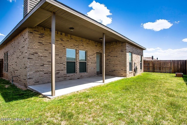 3404 Saratoga Ave, Lubbock, TX 79407 - back of house with brick siding and a patio area