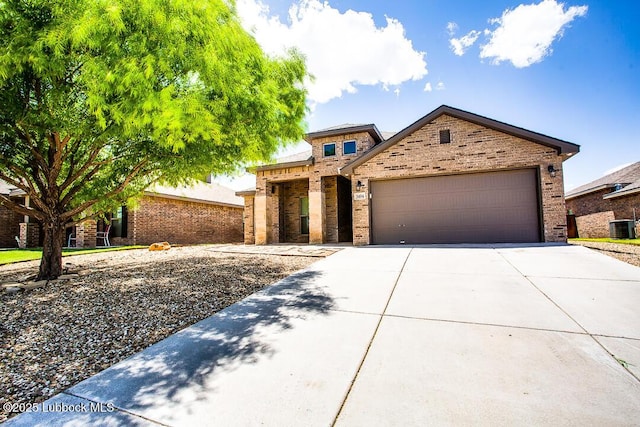 3404 Saratoga Ave, Lubbock, TX 79407 - view of front facade with driveway, a garage, and brick siding
