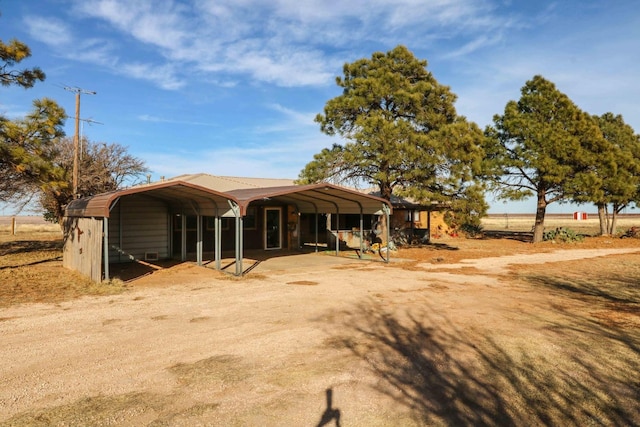 view of front of home featuring a carport