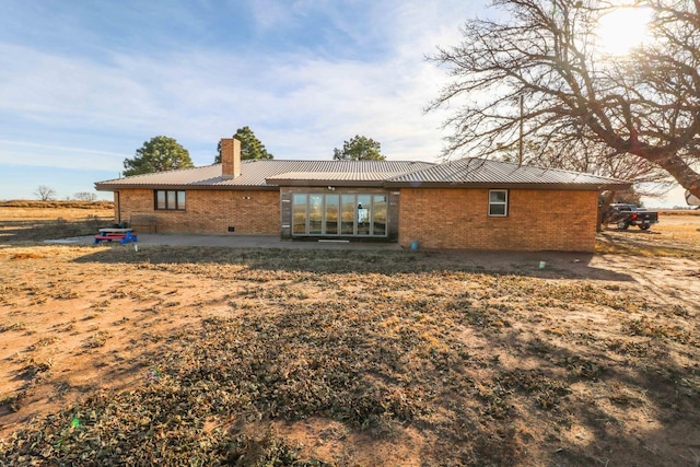 back of house featuring a patio