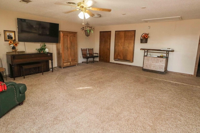 carpeted living room featuring ceiling fan