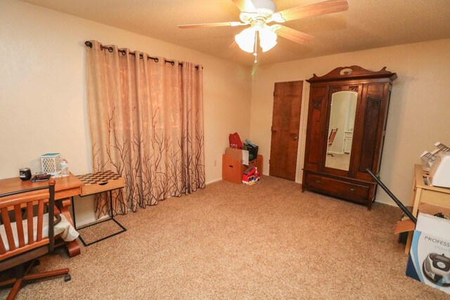 interior space with ceiling fan