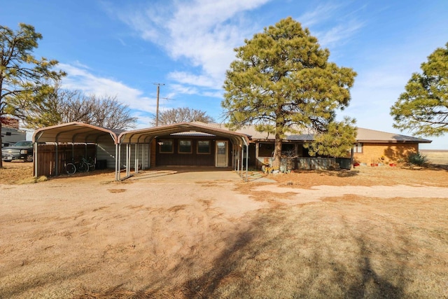 view of front of home with a carport