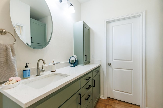 bathroom with vanity and wood-type flooring