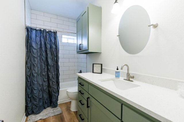 full bathroom with vanity, wood-type flooring, shower / tub combo, and toilet