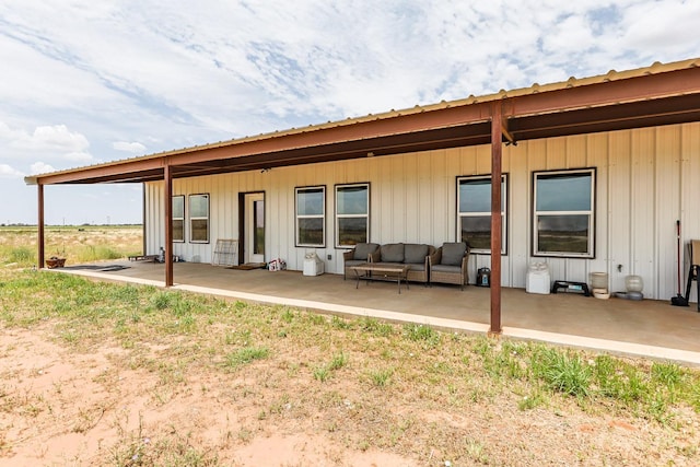 back of house featuring an outdoor hangout area and a patio