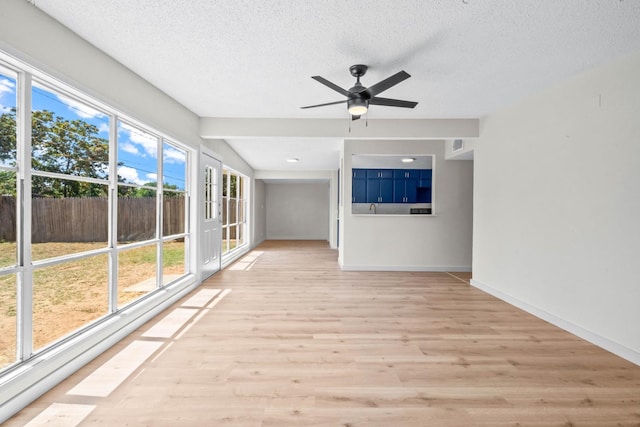 interior space featuring ceiling fan