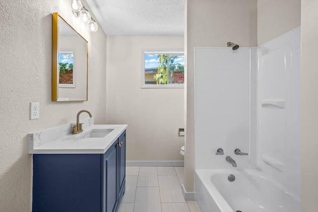 full bathroom featuring vanity, toilet, bathing tub / shower combination, and a textured ceiling