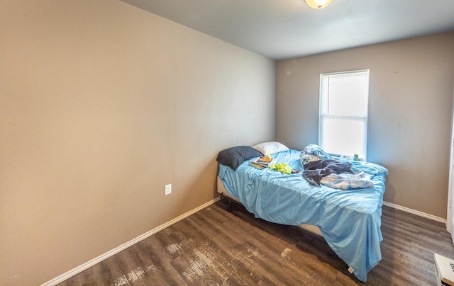 bedroom featuring dark hardwood / wood-style floors