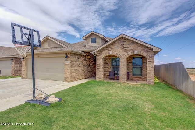 10423 Winfield Ave, Lubbock, TX 79424 - view of front of house featuring brick siding, concrete driveway, an attached garage, and roof with shingles