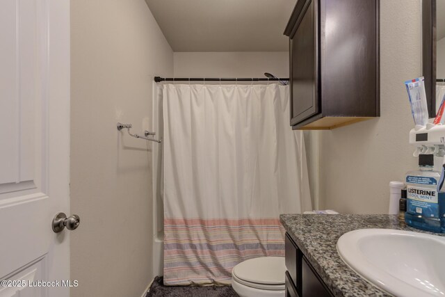 10423 Winfield Ave, Lubbock, TX 79424 - bathroom with toilet, vanity, and shower / tub combo with curtain