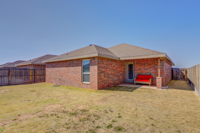 8413 10th Pl, Lubbock, TX 79416 - back of house featuring brick siding and roof with shingles