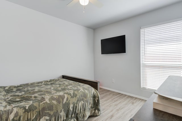 8413 10th Pl, Lubbock, TX 79416 - bedroom with wood finished floors, baseboards, and ceiling fan