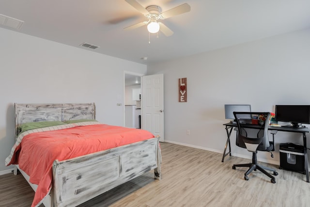 8413 10th Pl, Lubbock, TX 79416 - bedroom with wood finished floors, baseboards, a desk, and a ceiling fan