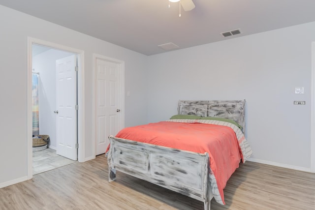 8413 10th Pl, Lubbock, TX 79416 - bedroom featuring wood finished floors, baseboards, and ceiling fan