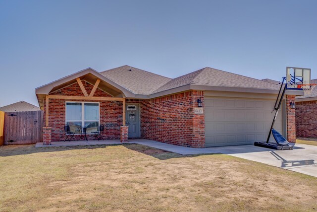8413 10th Pl, Lubbock, TX 79416 - ranch-style house with brick siding, an attached garage, driveway, and a shingled roof