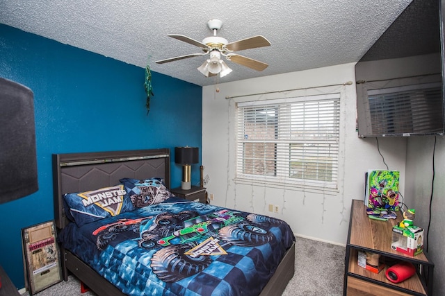 carpeted bedroom featuring ceiling fan and a textured ceiling