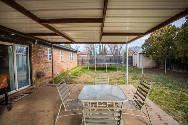 view of patio / terrace with a shed