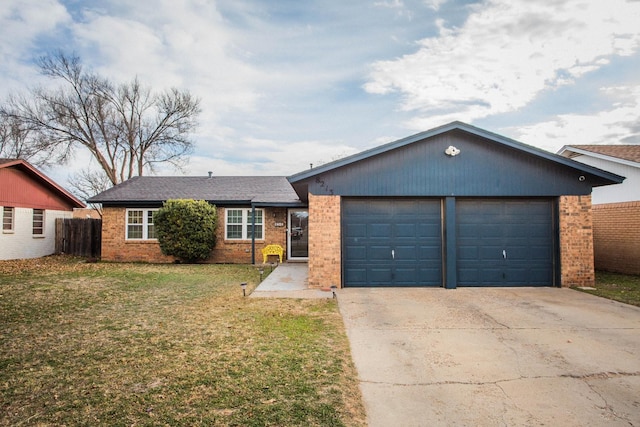 ranch-style house with a garage and a front lawn