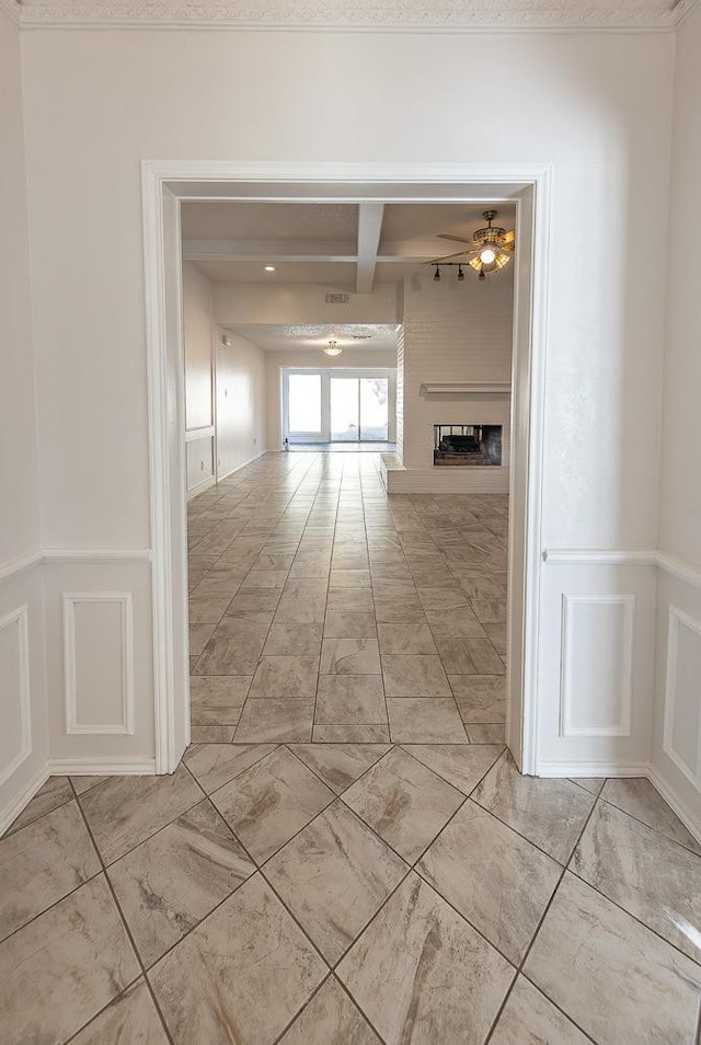 hall featuring beamed ceiling