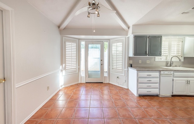 kitchen with lofted ceiling with beams, ceiling fan, sink, and light tile patterned floors