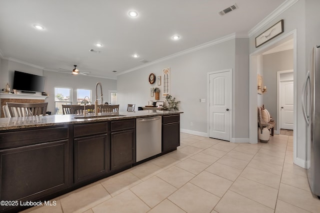 3634 Ridgely Ave, Lubbock, TX 79407 - kitchen featuring appliances with stainless steel finishes, ceiling fan, stone countertops, crown molding, and recessed lighting