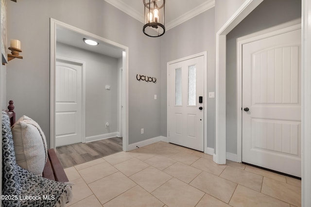 3634 Ridgely Ave, Lubbock, TX 79407 - foyer entrance featuring crown molding and light tile patterned flooring