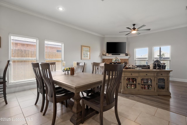 3634 Ridgely Ave, Lubbock, TX 79407 - dining room featuring ceiling fan, crown molding, light tile patterned floors, a fireplace, and recessed lighting