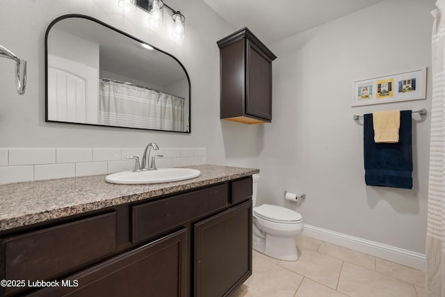 3634 Ridgely Ave, Lubbock, TX 79407 - bathroom featuring vanity, tile patterned floors, and decorative backsplash