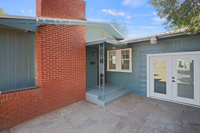 entrance to property with a patio area and french doors