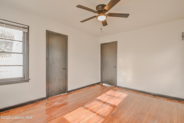 2014 60th St, Lubbock, TX 79412 - unfurnished room featuring light wood-style floors, healthy amount of natural light, and a ceiling fan